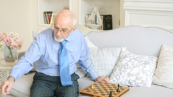 Elderly Grandmaster Plays Chess Alone, Old Man Playing Chess