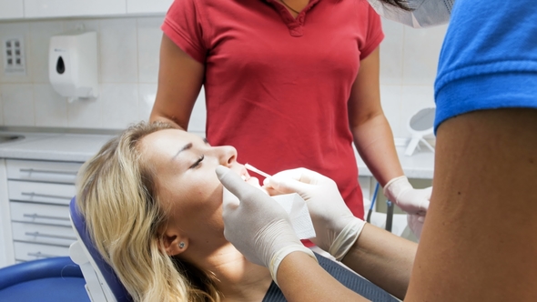 Video of Dentist Removing Lipstick From Patient's Lips Before Teeth Treatment