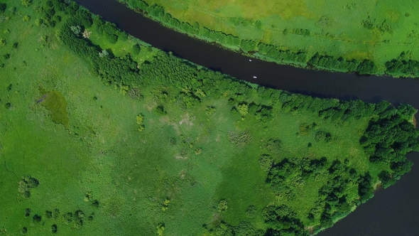 Flight Over River in Meadows