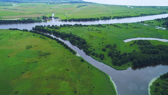 Flight Over River in Meadows