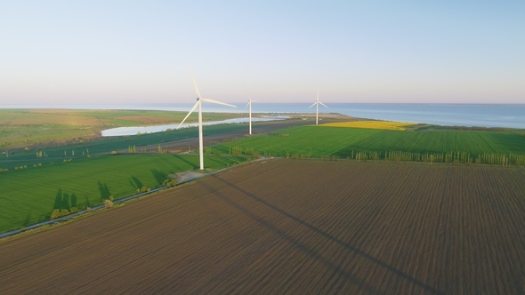 Wind Turbines and Agricultural Fields - Energy Production with Clean and Renewable Energy alt