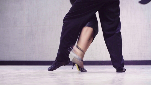 Legs of Professional Dancers Dancing Tango