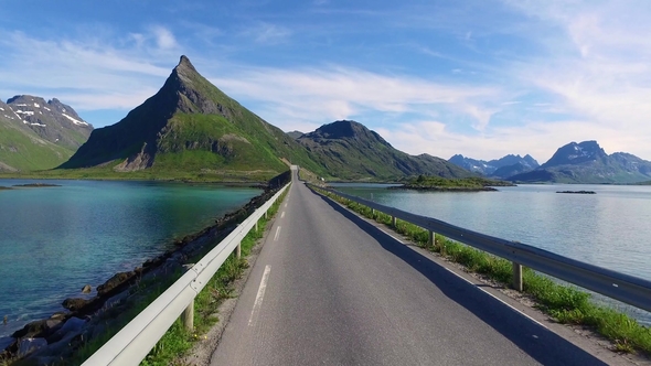 Driving a Car on a Road in Norway Lofoten alt