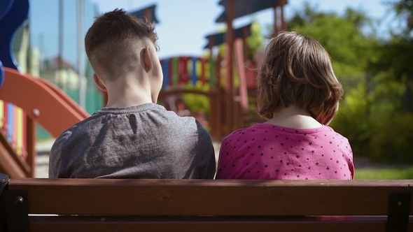 Boy and Girl Sitting on the Bench