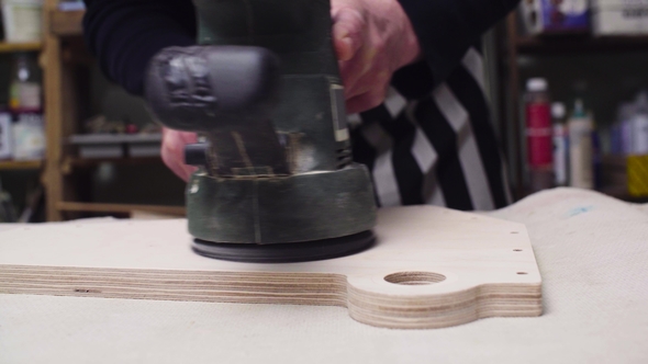 Grinding a Furniture Part with a Handheld Machine