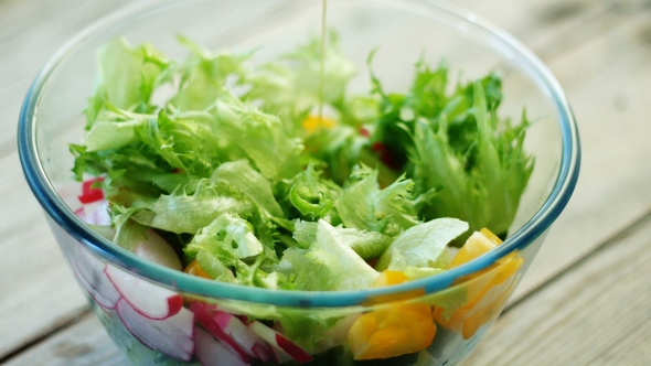 - Pouring Dressing Over Salad alt