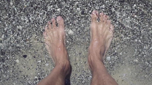 Male Feet on the Beach at Seaside