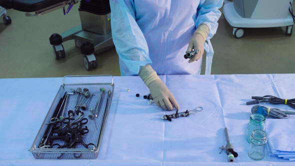 A Nurse Putting on the Table a Medical Instruments