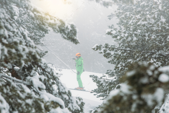 Skier uses the ski lift while takes a self photograph - Stock Photo - Images
