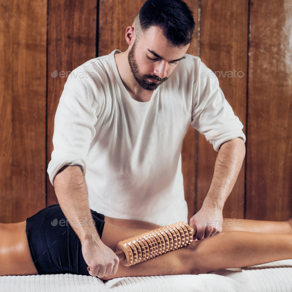Close up of therapist doing anti cellulite Madero therapy massag - Stock Photo - Images