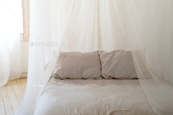 beautiful bedroom with wooden four poster bed Stock Photo by lyulkamazur
