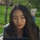 Charming Asian Girl with Tablet Pc in Spring Park - VideoHive Item for Sale