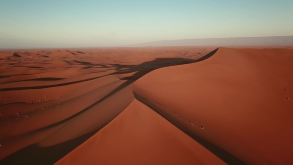 Aerial of Sand Dunes in Sahara Desert at Sunrise alt