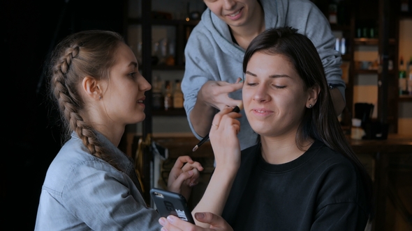 Make-up Artist and Hairdresser Working with Woman Client
