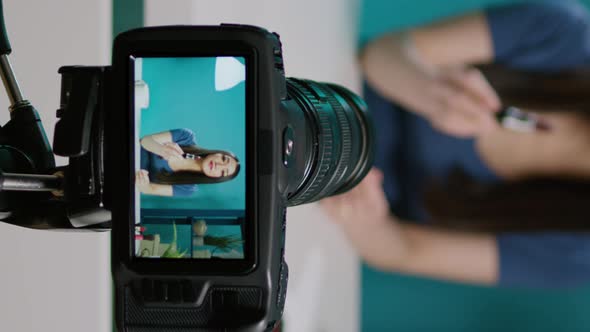 Vertical Video Social Media Blogger Filming Product Review with Camera alt