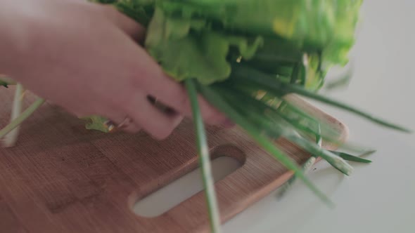 Woman Is Washing Fresh Organic Red Pepper Under Running Water in Kitchen Sink alt