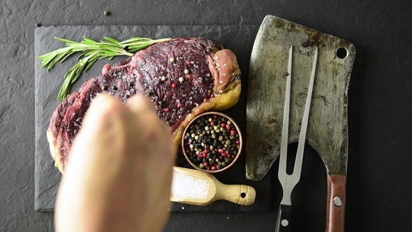 Marbling Ribeye Steak on Black Plate