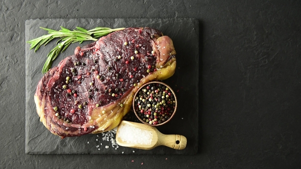 Marbling Ribeye Steak on Black Plate