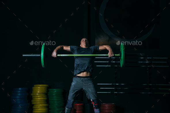 Man doing power snatch exercise - Stock Photo - Images