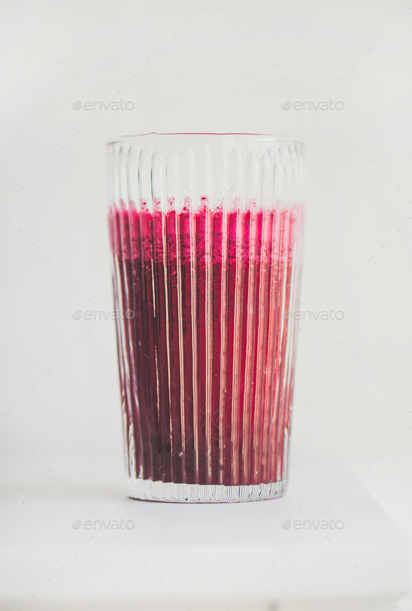 Fresh detox beetroot smoothie in glass, white background, copy space - Stock Photo - Images