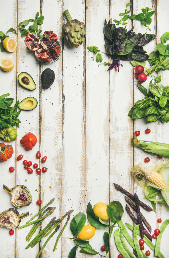 Healthy raw summer vegan ingredients over wooden background - Stock Photo - Images