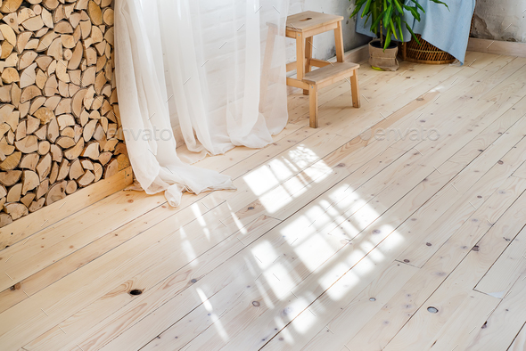 Glass windows with white curtains, flower in a pot on the floor and view over the trees. - Stock Photo - Images