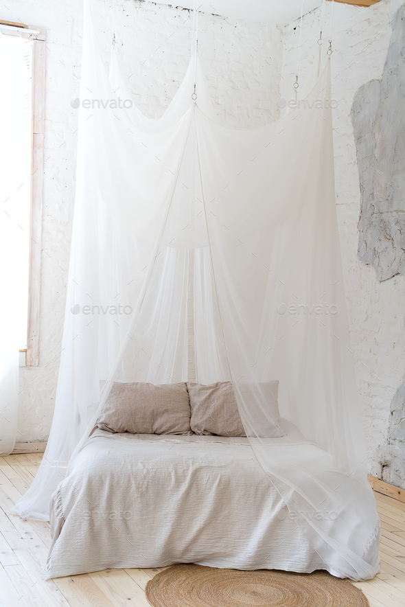 beautiful bedroom with wooden four poster bed Stock Photo by lyulkamazur