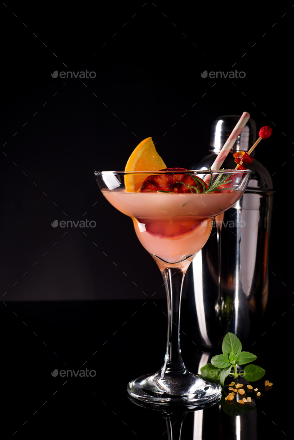 French daiquiri, alcohol cocktail with lemon juice, sugar syrup, cognac, mint and orange Stock Photo by lyulkamazur