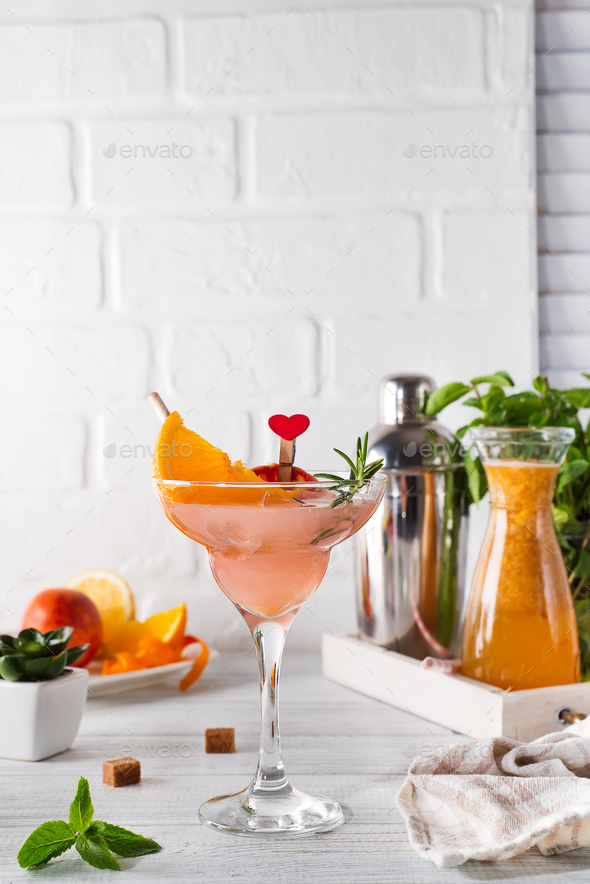Refreshing summer alcoholic cocktail margarita on light wooden background - Stock Photo - Images