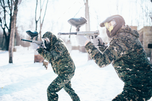 Paintball team in uniform attack in winter battle - Stock Photo - Images