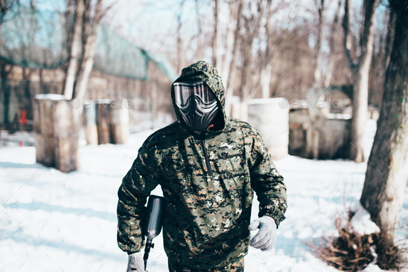Male paintball player, military game equipment - Stock Photo - Images