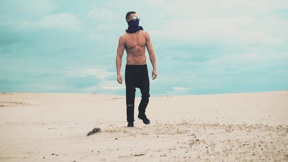 Man Is Walking in Desert