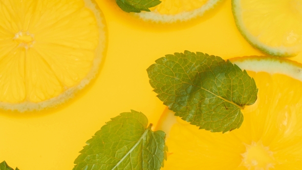 Video of Fresh Mint Leaves and Orange Slices Floating in Lemonade