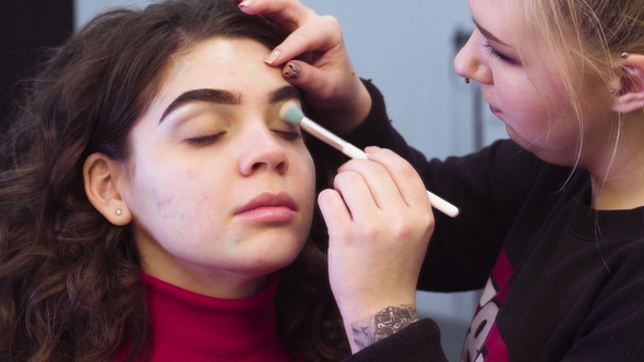 Makeup Artist Applying Eyeshadow