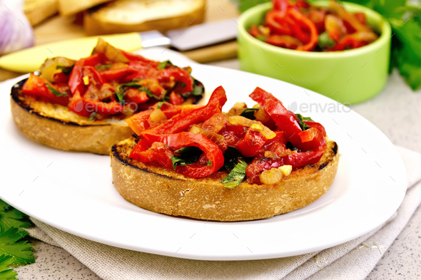 Bruschetta with vegetables in plate on granite table - Stock Photo - Images