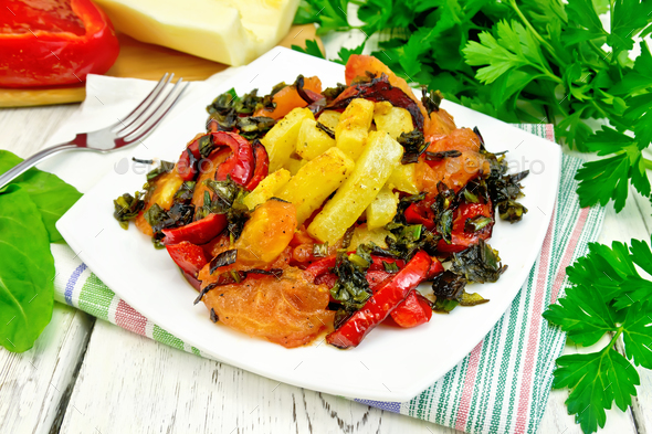 Courgettes with vegetables in plate on table - Stock Photo - Images