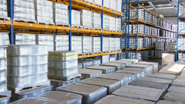 Forklift Loader Drives Pallets with Bobbins at Warehouse alt