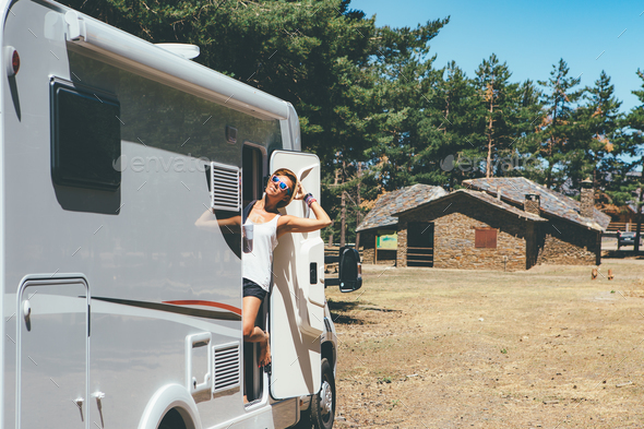 Happy girl relaxes on a motor home - Stock Photo - Images