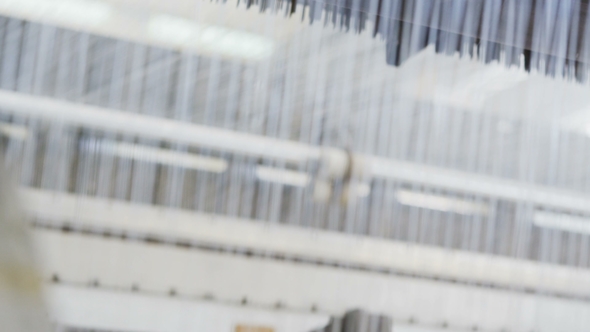 Loom Weaves Cloth Using Threads for Pipes Protection alt