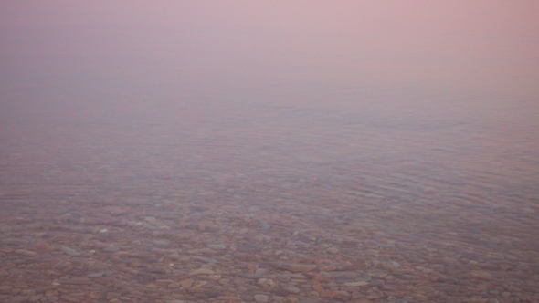 Beautiful Calm Water Surface at Majestic Sunset alt