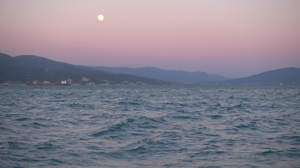 Beautiful Sunset, Rising Moon Over Sea and Mountain