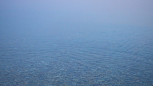 Beautiful Morning Calm Water Surface with Fog. alt