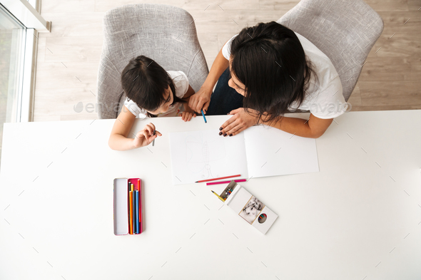 Image from above of young woman and little kid taking pleasure w - Stock Photo - Images