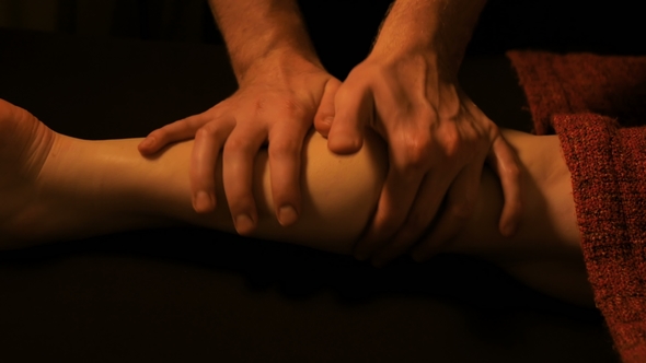 Woman Client Having Professional Leg Massage