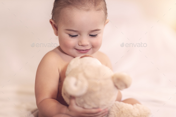 Cute baby with a bear - Stock Photo - Images