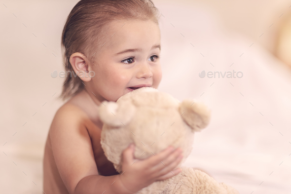 Little boy with soft toy - Stock Photo - Images