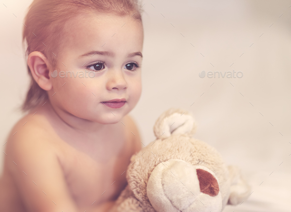 Little boy with soft toy - Stock Photo - Images