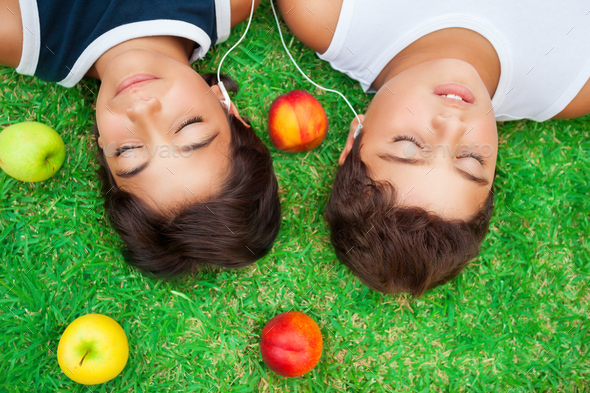 Boys listening music outdoors - Stock Photo - Images