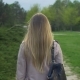 Joyful Blonde Girl Turning Back and Smiling in Park - VideoHive Item for Sale