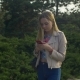 Charming Woman Walking and Using Cellphone in Park - VideoHive Item for Sale